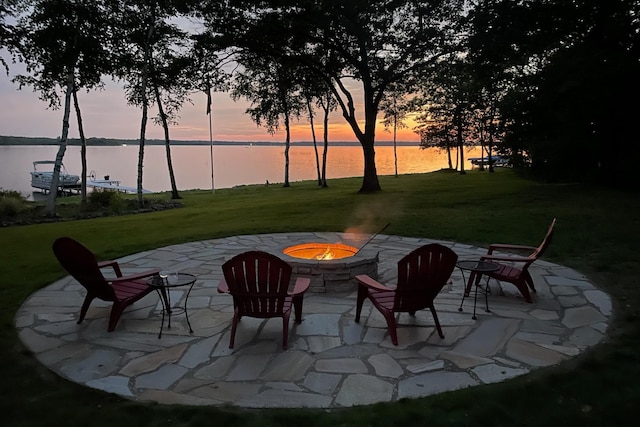 10924 E Grand Lake Rd, Presque Isle, MI 49777 - view of patio / terrace featuring an outdoor fire pit and a water view