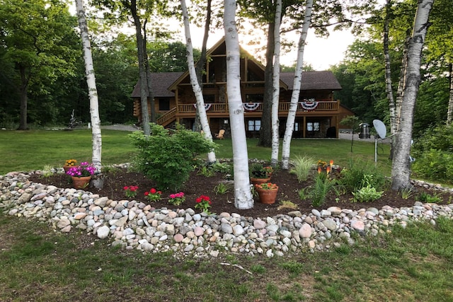 10924 E Grand Lake Rd, Presque Isle, MI 49777 - rear view of house featuring a yard, stairway, and a deck