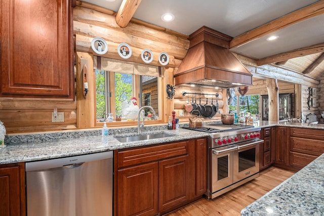 10924 E Grand Lake Rd, Presque Isle, MI 49777 - kitchen featuring appliances with stainless steel finishes, premium range hood, a sink, light wood-type flooring, and plenty of natural light