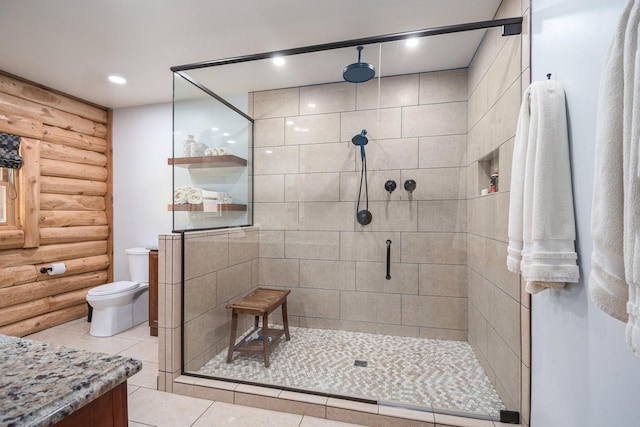 10924 E Grand Lake Rd, Presque Isle, MI 49777 - full bathroom with log walls, tiled shower, vanity, tile patterned flooring, and toilet