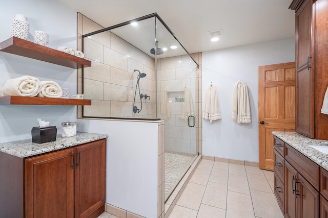 10924 E Grand Lake Rd, Presque Isle, MI 49777 - bathroom with a stall shower, tile patterned flooring, vanity, recessed lighting, and baseboards