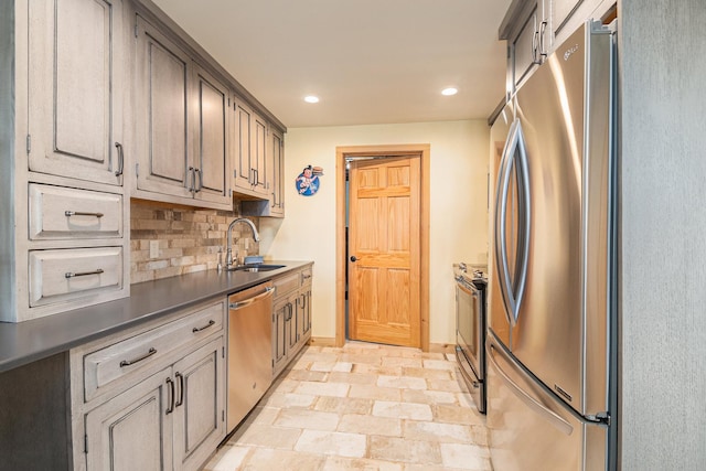 10924 E Grand Lake Rd, Presque Isle, MI 49777 - kitchen with stainless steel appliances, a sink, recessed lighting, backsplash, and baseboards