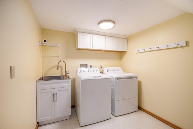 10924 E Grand Lake Rd, Presque Isle, MI 49777 - laundry area featuring washer and clothes dryer, cabinet space, and baseboards