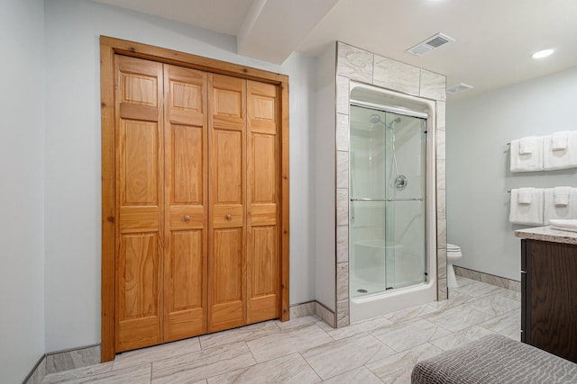 10924 E Grand Lake Rd, Presque Isle, MI 49777 - bathroom featuring a closet, toilet, a stall shower, vanity, and baseboards