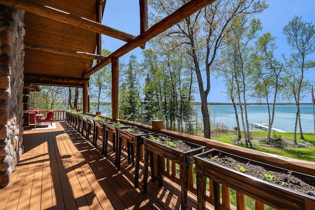 10924 E Grand Lake Rd, Presque Isle, MI 49777 - wooden terrace with a water view
