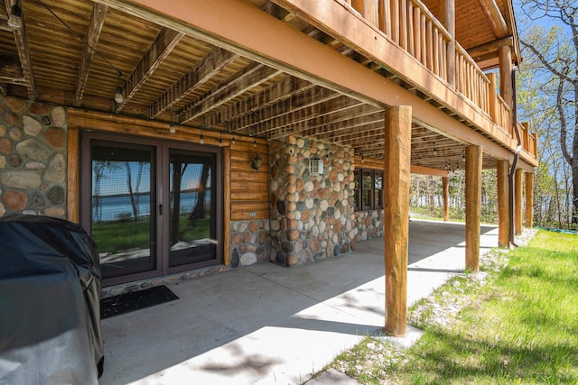 10924 E Grand Lake Rd, Presque Isle, MI 49777 - view of patio with a carport, french doors, and grilling area
