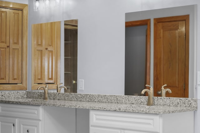 4348 W Lakeside Dr, West Branch, MI 48661 - bathroom featuring double vanity