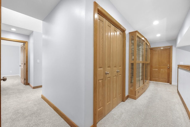 4348 W Lakeside Dr, West Branch, MI 48661 - corridor featuring light carpet, baseboards, and recessed lighting