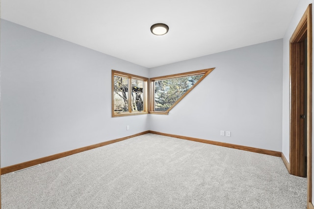 4348 W Lakeside Dr, West Branch, MI 48661 - carpeted empty room featuring baseboards