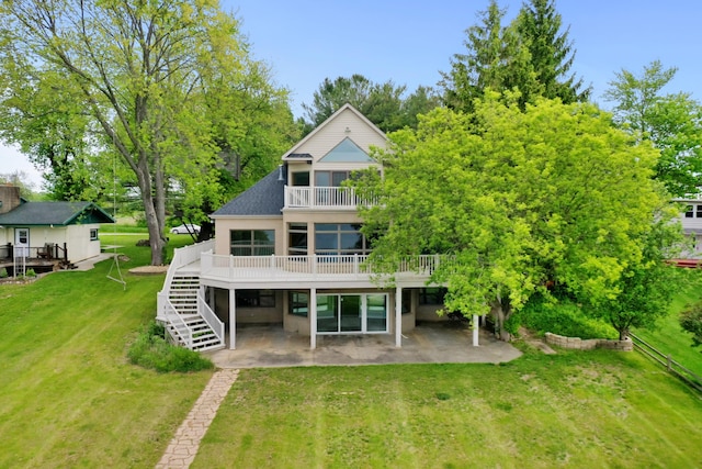 4348 W Lakeside Dr, West Branch, MI 48661 - rear view of property with a patio area, a deck, stairs, and a lawn