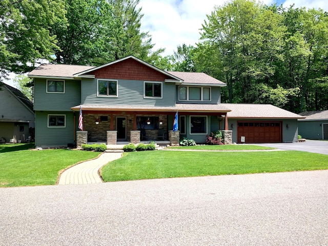 132 16th St, Prudenville, MI 48651 - craftsman-style house featuring a porch, a garage, asphalt driveway, and a front yard