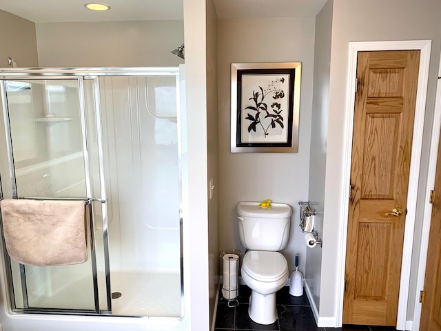 132 16th St, Prudenville, MI 48651 - full bath with a stall shower, toilet, baseboards, and tile patterned flooring