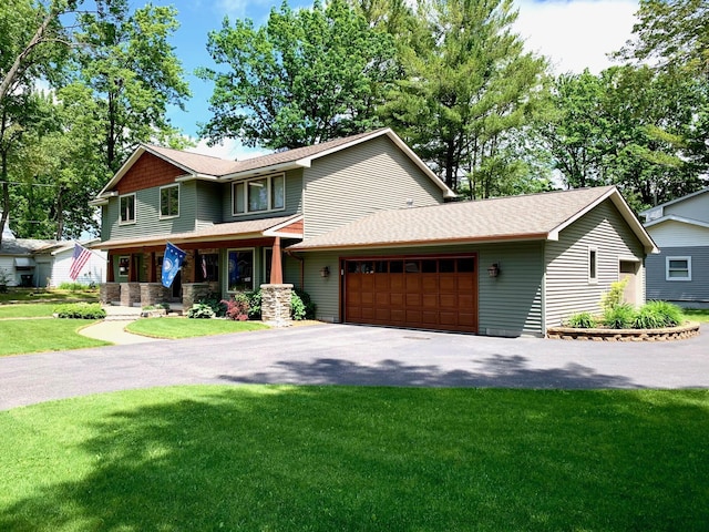 132 16th St, Prudenville, MI 48651 - view of front of property with a garage, driveway, a front lawn, a porch, and a shingled roof