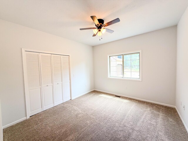 116 No Wake Ct, Houghton Lake, MI 48629 - unfurnished bedroom featuring carpet, baseboards, and a closet