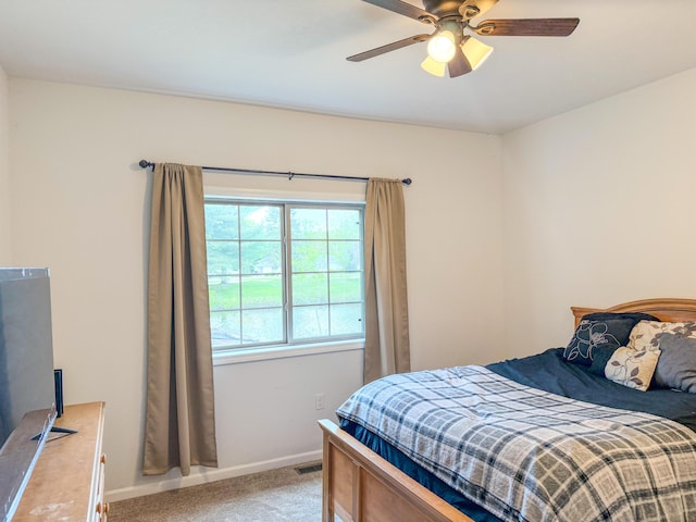 116 No Wake Ct, Houghton Lake, MI 48629 - bedroom with light colored carpet, baseboards, and a ceiling fan