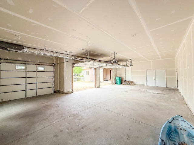 116 No Wake Ct, Houghton Lake, MI 48629 - garage featuring a garage door opener