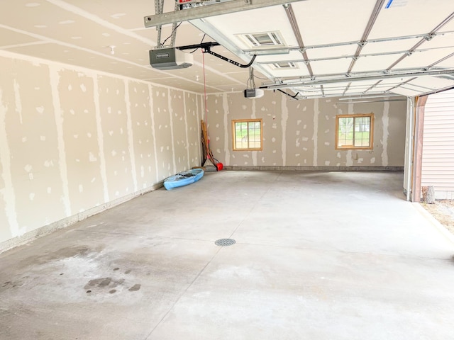 116 No Wake Ct, Houghton Lake, MI 48629 - garage featuring a garage door opener