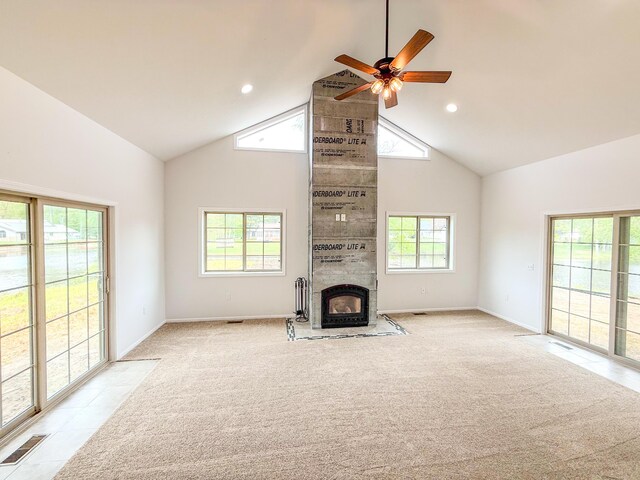 116 No Wake Ct, Houghton Lake, MI 48629 - unfurnished living room featuring high vaulted ceiling, healthy amount of natural light, light carpet, ceiling fan, and baseboards