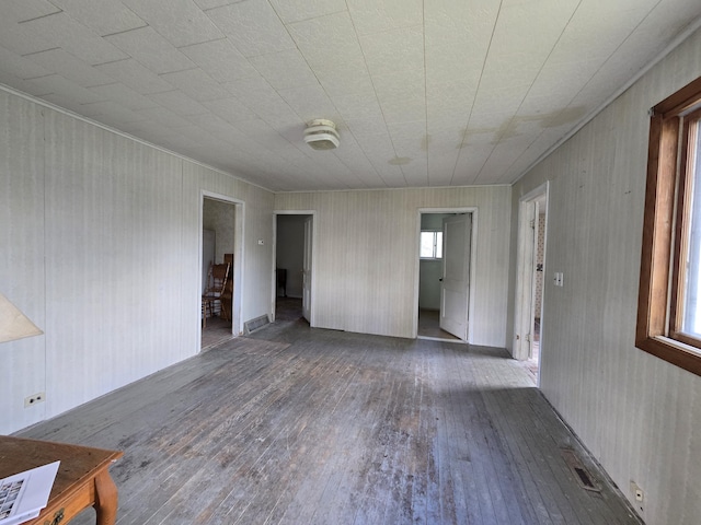 903 W 8th St, Mio, MI 48647 - spare room featuring wood-type flooring