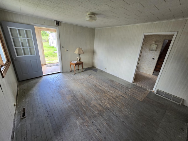 903 W 8th St, Mio, MI 48647 - unfurnished living room with hardwood / wood-style floors