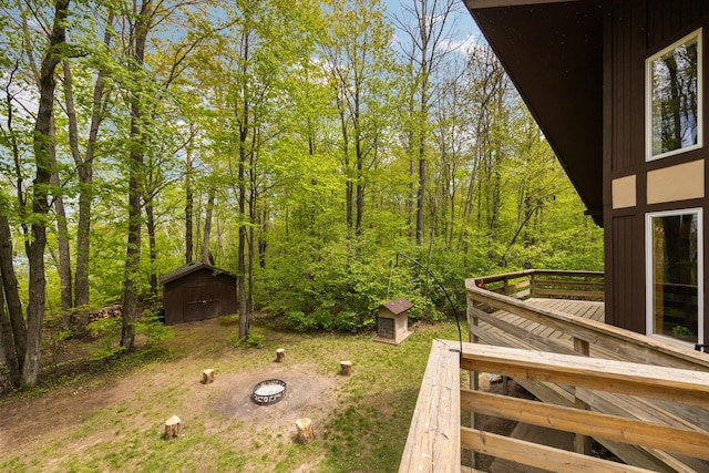 6192 Wilderness Dr, Mancelona, MI 49659 - view of yard with a wooden deck