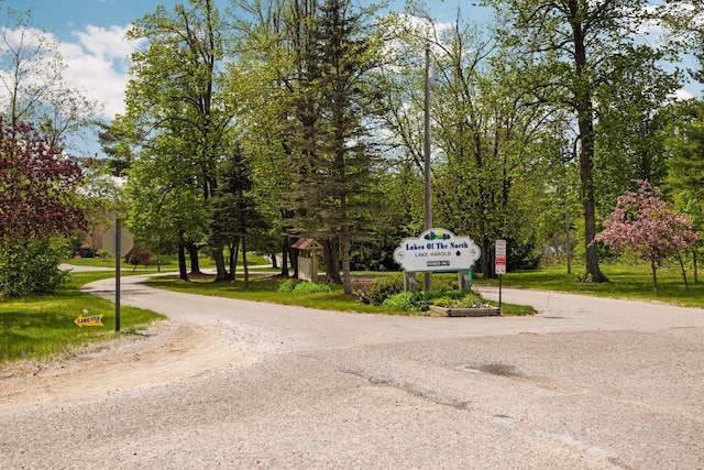 6192 Wilderness Dr, Mancelona, MI 49659 - view of road featuring traffic signs