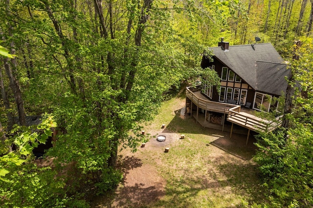 6192 Wilderness Dr, Mancelona, MI 49659 - view of subject property with a heavily wooded area