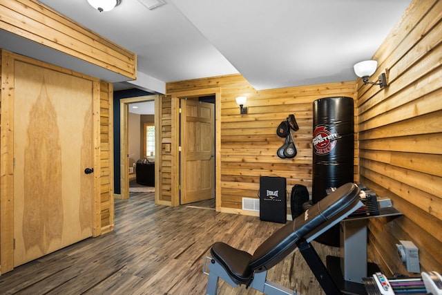 6192 Wilderness Dr, Mancelona, MI 49659 - workout room with wood finished floors and wood walls