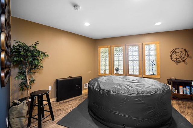 6192 Wilderness Dr, Mancelona, MI 49659 - bedroom with recessed lighting, light wood-style flooring, and baseboards