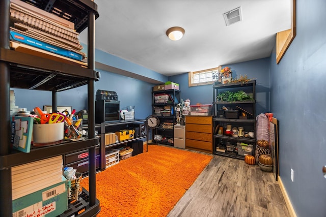 6192 Wilderness Dr, Mancelona, MI 49659 - office area with wood finished floors