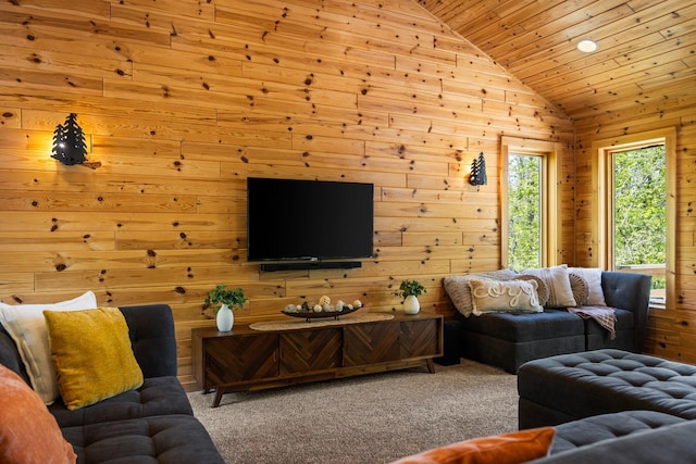 6192 Wilderness Dr, Mancelona, MI 49659 - living room with lofted ceiling, wooden ceiling, wood walls, and carpet flooring