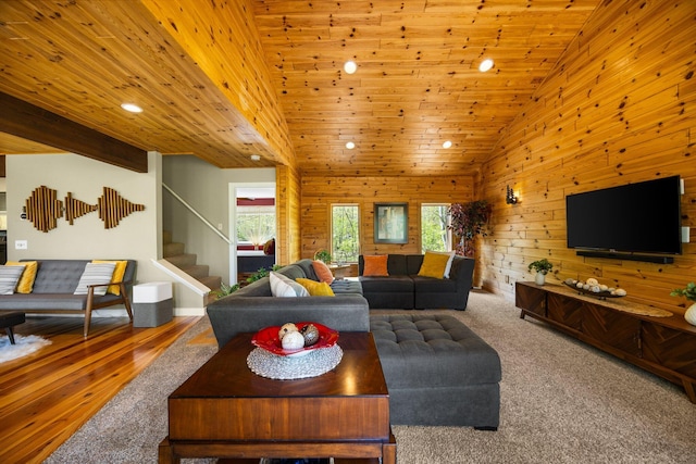 6192 Wilderness Dr, Mancelona, MI 49659 - living area featuring stairway, recessed lighting, wood ceiling, vaulted ceiling, and wooden walls