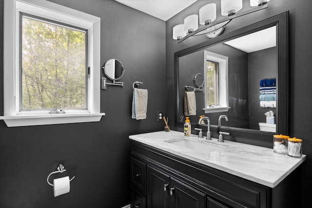 6192 Wilderness Dr, Mancelona, MI 49659 - bathroom with vanity and toilet