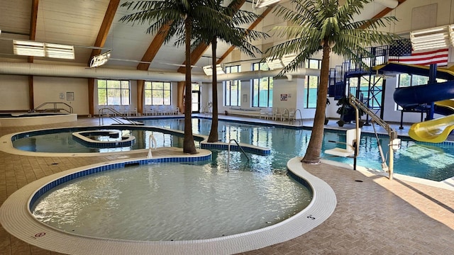 6192 Wilderness Dr, Mancelona, MI 49659 - indoor community pool featuring a hot tub and a water slide