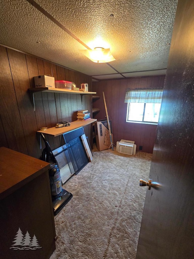 3557 Penn Rd, Lewiston, MI 49756 - interior space featuring wood walls, carpet, and a textured ceiling