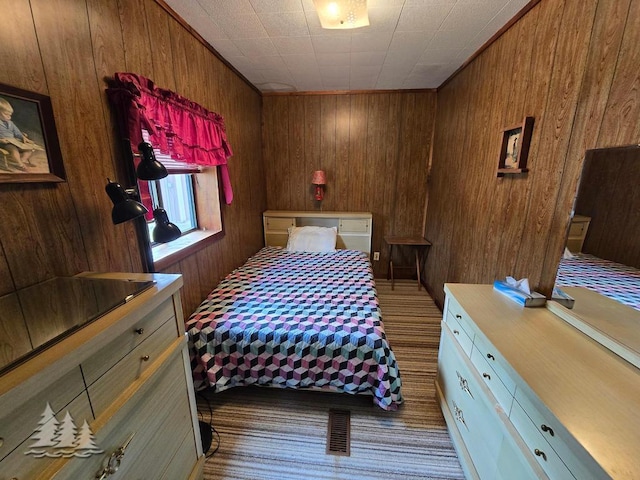 3557 Penn Rd, Lewiston, MI 49756 - carpeted bedroom featuring wood walls