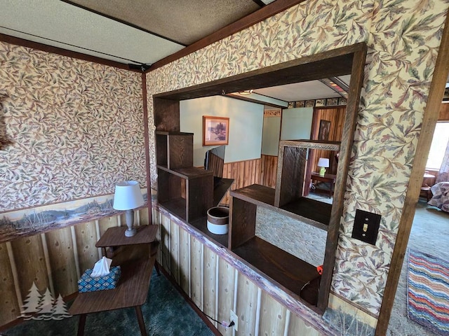 3557 Penn Rd, Lewiston, MI 49756 - interior space featuring wallpapered walls, wainscoting, carpet flooring, a textured ceiling, and wood walls