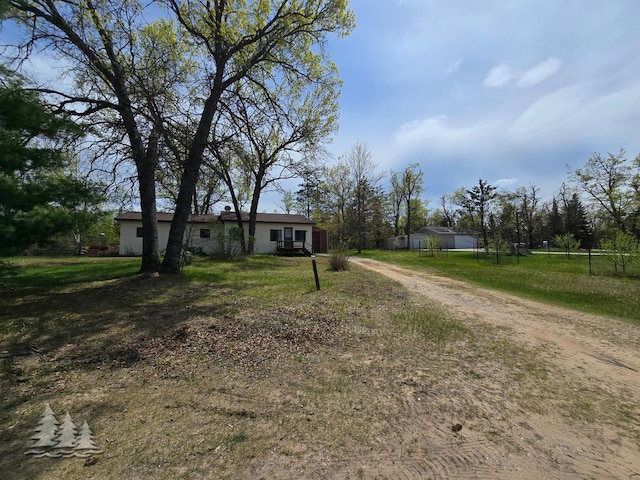 3557 Penn Rd, Lewiston, MI 49756 - ranch-style home featuring driveway