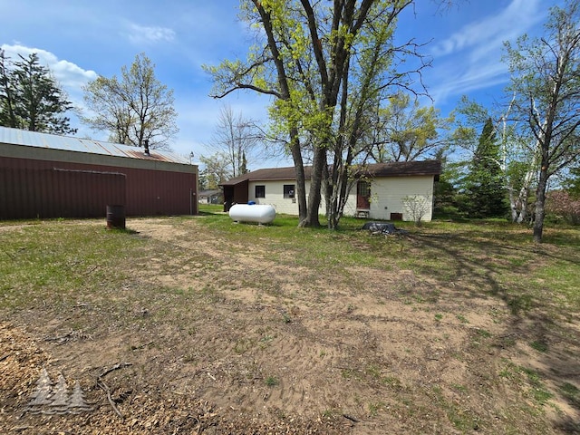 3557 Penn Rd, Lewiston, MI 49756 - view of yard featuring an outbuilding and an outdoor structure