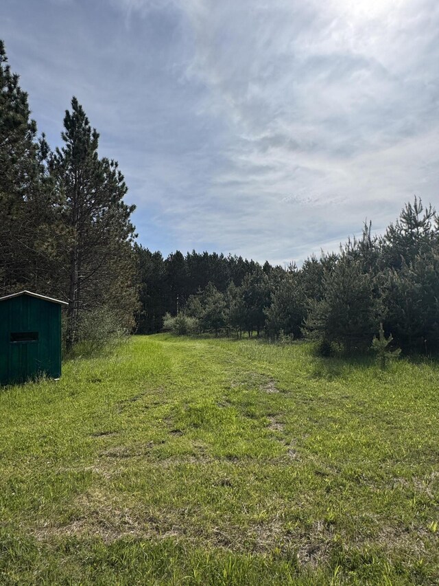1154 M-72 W, Barton City, MI 48705 - view of yard featuring a wooded view