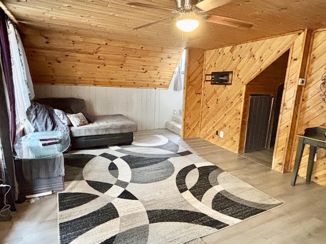 3334 Pleasant View Dr, Lewiston, MI 49756 - sitting room featuring wooden walls, ceiling fan, wooden ceiling, and wood finished floors