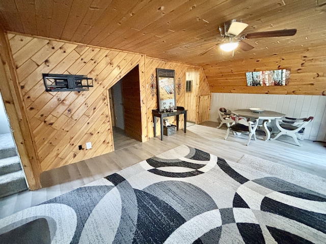 3334 Pleasant View Dr, Lewiston, MI 49756 - living area with wood walls, wood finished floors, a ceiling fan, and wooden ceiling
