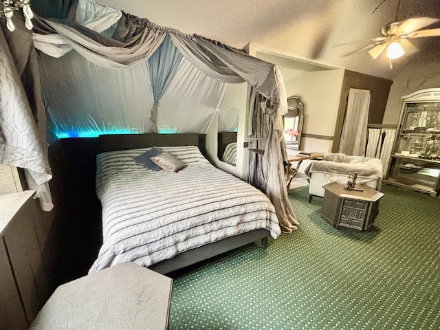 3334 Pleasant View Dr, Lewiston, MI 49756 - carpeted bedroom with lofted ceiling and ceiling fan