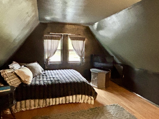 3334 Pleasant View Dr, Lewiston, MI 49756 - bedroom with vaulted ceiling and wood finished floors