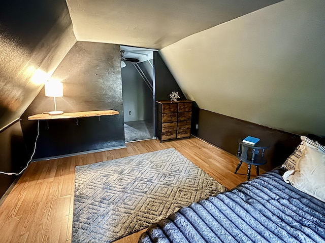 3334 Pleasant View Dr, Lewiston, MI 49756 - bedroom featuring lofted ceiling and wood finished floors