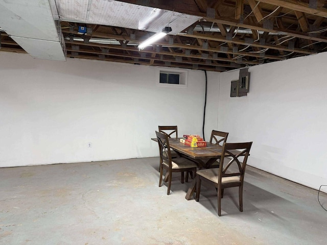 116 1st St, Hubbard Lake, MI 49747 - dining area featuring unfinished concrete floors and electric panel