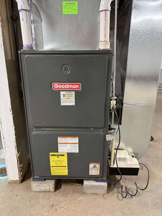 116 1st St, Hubbard Lake, MI 49747 - utility room with heating unit