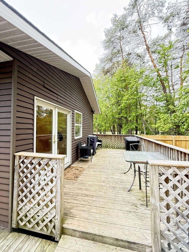 116 1st St, Hubbard Lake, MI 49747 - wooden terrace featuring outdoor dining space