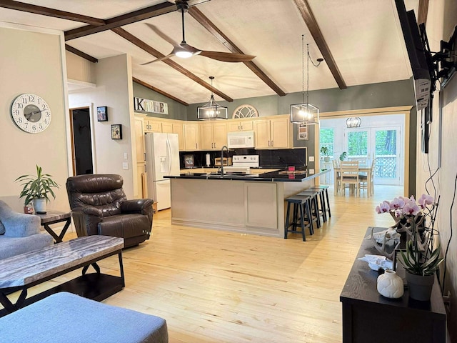 116 1st St, Hubbard Lake, MI 49747 - living area featuring light wood-style flooring and a ceiling fan