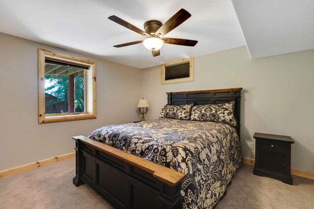 5997 Prospect St, Indian River, MI 49749 - bedroom with light carpet, baseboards, and a ceiling fan